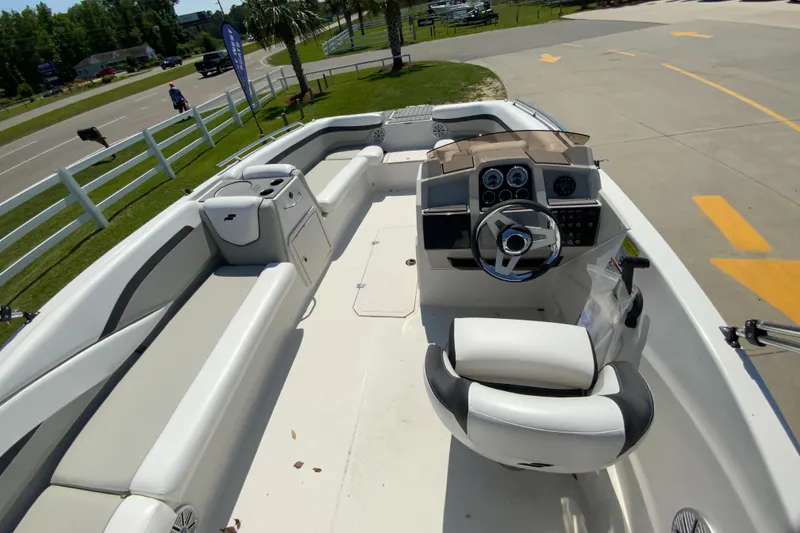 Slide: The Image of 2024 Starcraft SVX 191 boat interior with steering console and seating. - 10