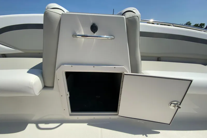 Slide: The Image of 2024 Starcraft SVX 191 boat storage compartment with open door. - 20