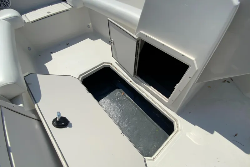 Slide: The Image of 2024 Starcraft SVX 191 boat storage compartments and seating area. - 21