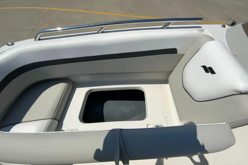 Slide: The Image of 2024 Starcraft SVX 191 boat seating area with storage compartment. - 25