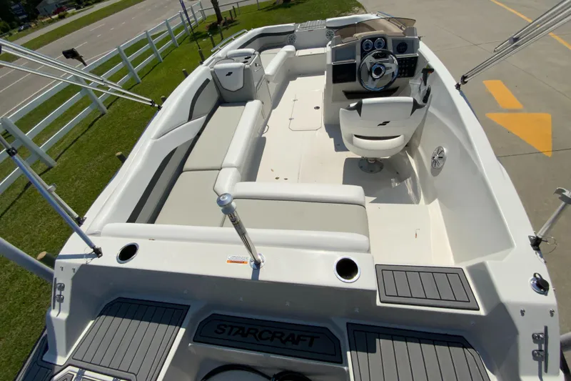Slide: The Image of 2024 Starcraft SVX 191 boat interior with seating and steering console. - 9