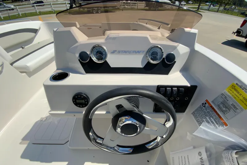 Slide: The Image of 2024 Starcraft SVX 171 boat dashboard with steering wheel and instrument panel. - 10