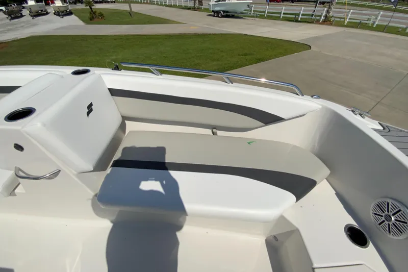 Slide: The Image of 2024 Starcraft SVX 171 boat interior seating area with cup holders and speaker. - 15