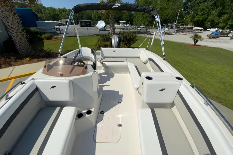 Slide: The Image of 2024 Starcraft SVX 171 boat interior with seating and steering console. - 21