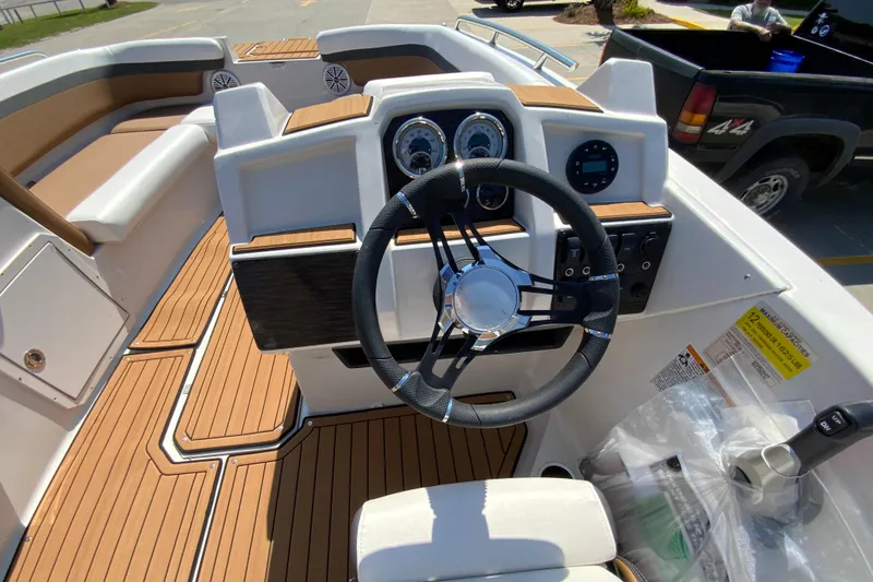 Slide: The Image of 2024 Starcraft SVX 191 boat interior with steering wheel and dashboard. - 10