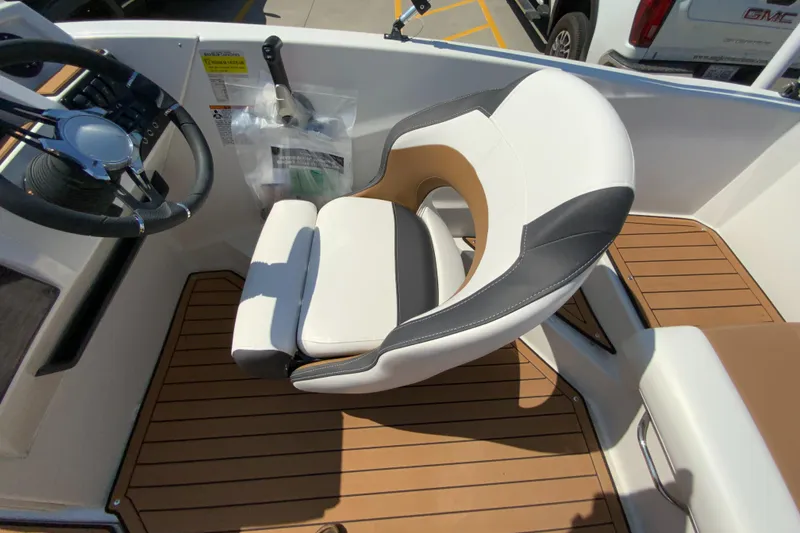 Slide: The Image of 2024 Starcraft SVX 191 boat captain's chair and helm station. - 11