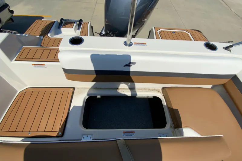 Slide: The Image of 2024 Starcraft SVX 191 boat interior with storage compartment and seating. - 12