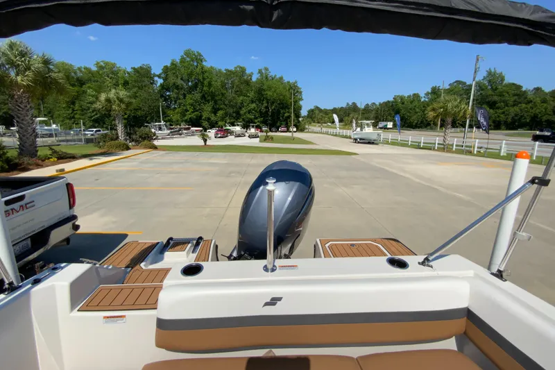 Slide: The Image of 2024 Starcraft SVX 191 boat with outboard motor in parking lot. - 6