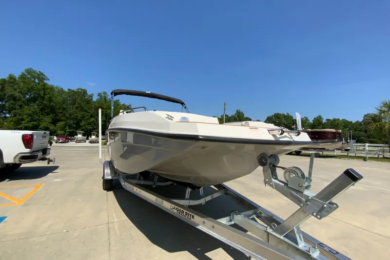 Slide: The Image of 2024 Starcraft SVX 191 boat on a trailer in a parking lot. - 7