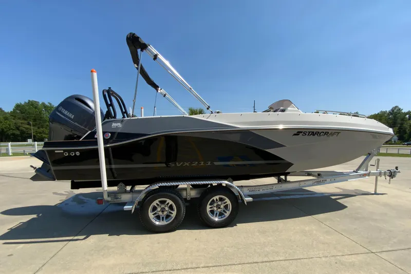Slide: The Image of 2023 Starcraft SVX 211 boat on a trailer, side view. - 1