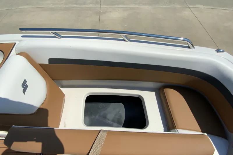 Slide: The Image of 2023 Starcraft SVX 211 boat interior with tan and white seating. - 16