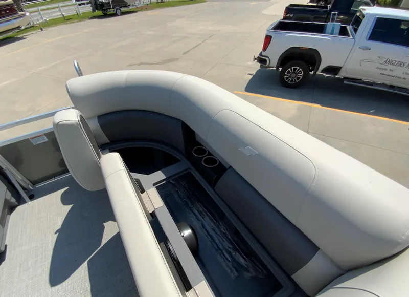 Slide: The Image of 2024 Starcraft LX20 R pontoon boat with spacious seating and cup holders. - 10