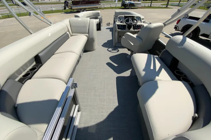 Slide: The Image of 2024 Starcraft LX20 R pontoon boat interior with spacious seating and modern helm. - 16