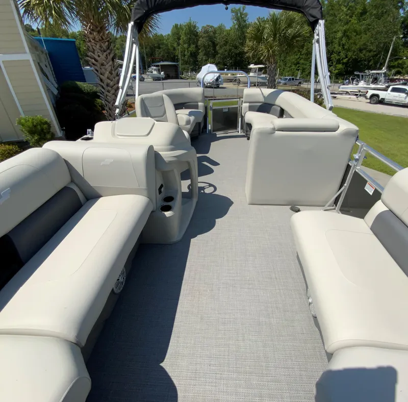 Slide: The Image of 2024 Starcraft LX20 R pontoon boat interior with spacious seating and modern design. - 6
