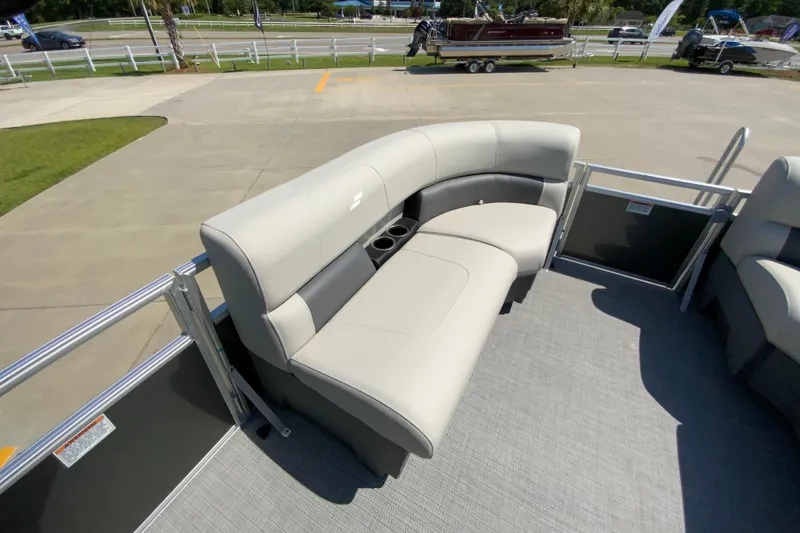 Slide: The Image of 2024 Starcraft LX20 R pontoon boat with comfortable seating and cup holders. - 19