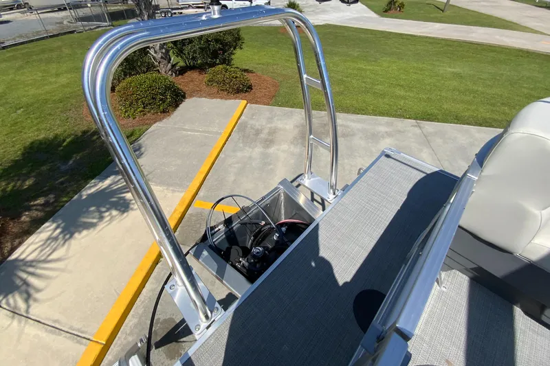 Slide: The Image of 2024 Starcraft LX20 R boat with a view of the rear deck and ladder. - 5