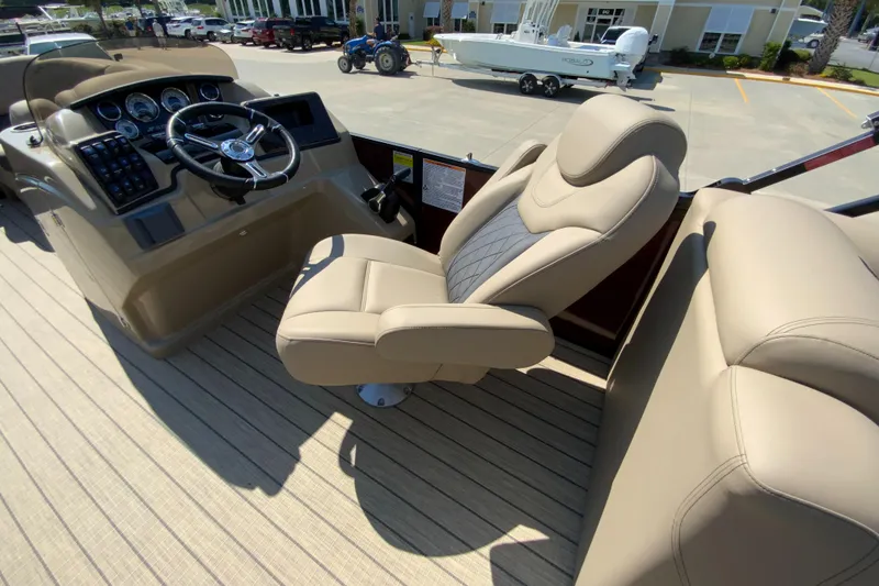 Slide: The Image of 2024 Starcraft SLS 3 boat interior with captain's chair and helm. - 10