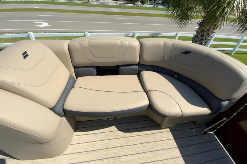 Slide: The Image of 2024 Starcraft SLS 3 boat with beige and gray cushioned seating. - 17
