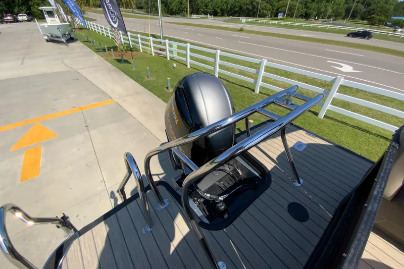 Slide: The Image of 2024 Starcraft SLS 3 boat with outboard motor and stainless steel railing. - 22