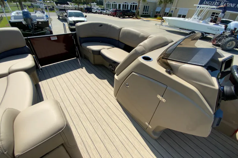 Slide: The Image of 2024 Starcraft SLS 3 boat interior with beige seating and modern dashboard. - 14