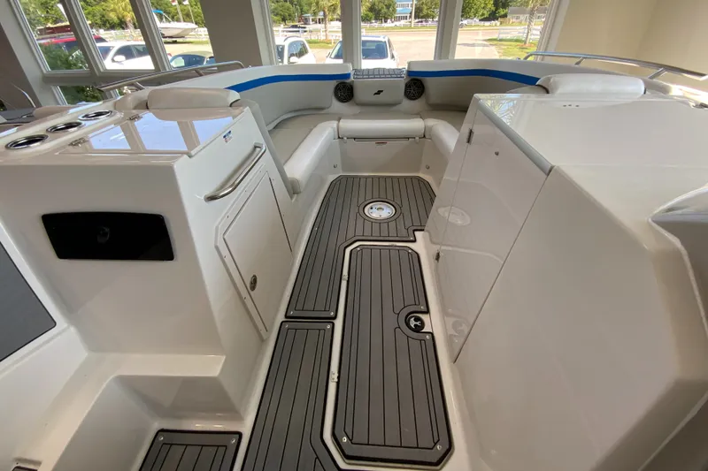 Slide: The Image of 2024 Starcraft SVX 231 boat interior with modern seating and sleek flooring. - 10