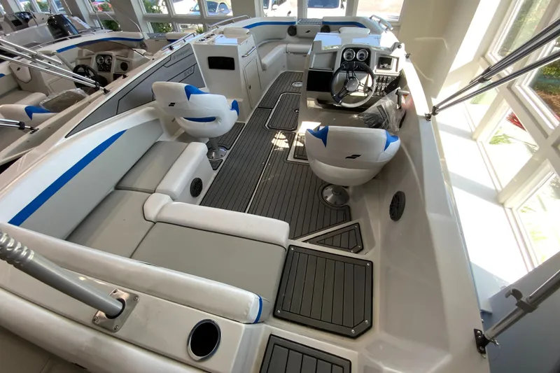 Slide: The Image of 2024 Starcraft SVX 231 boat interior with seating and control console. - 16