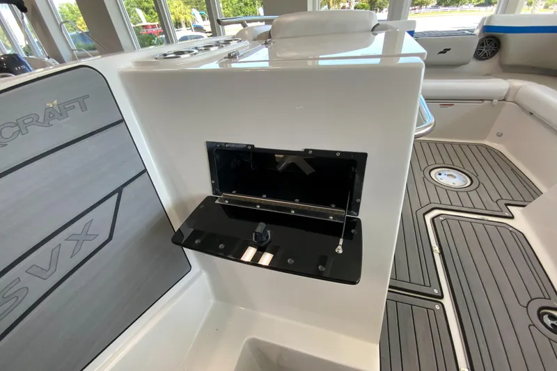 Slide: The Image of 2024 Starcraft SVX 231 boat interior with storage compartment and seating. - 17