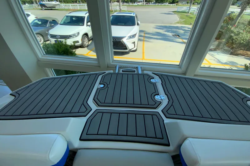 Slide: The Image of 2024 Starcraft SVX 231 boat deck with black and gray flooring. - 25