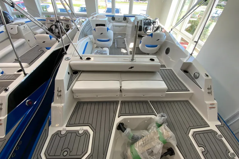 Slide: The Image of 2024 Starcraft SVX 231 boat interior with seating and steering console. - 4