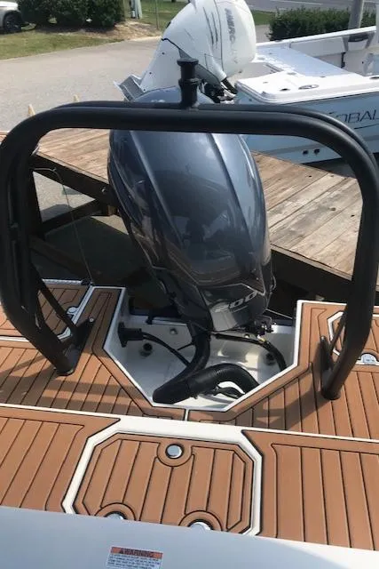Slide: The Image of 2024 Starcraft SVX 211 boat with outboard motor and teak deck. - 17
