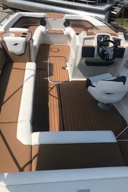 Slide: The Image of 2024 Starcraft SVX 211 boat interior with tan and white seating. - 5