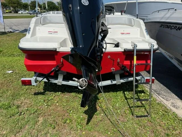 Slide: The Image of 2024 Bayliner Element M17 boat rear view with outboard motor and ladder. - 3
