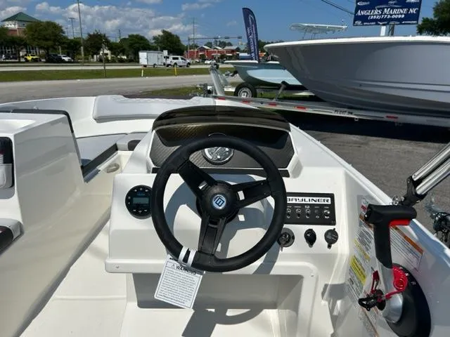 Slide: The Image of 2024 Bayliner Element M17 boat dashboard and steering wheel. - 9