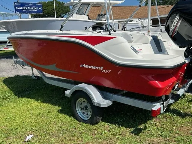 Slide: The Image of 2024 Bayliner Element M17 boat in red on a trailer. - 2