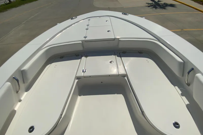 Slide: The Image of 2024 Robalo 246 Cayman boat bow with storage compartments. - 22