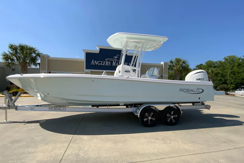 Slide: The Image of 2024 Robalo 246 Cayman boat on trailer at Anglers Marine dealership. - 3