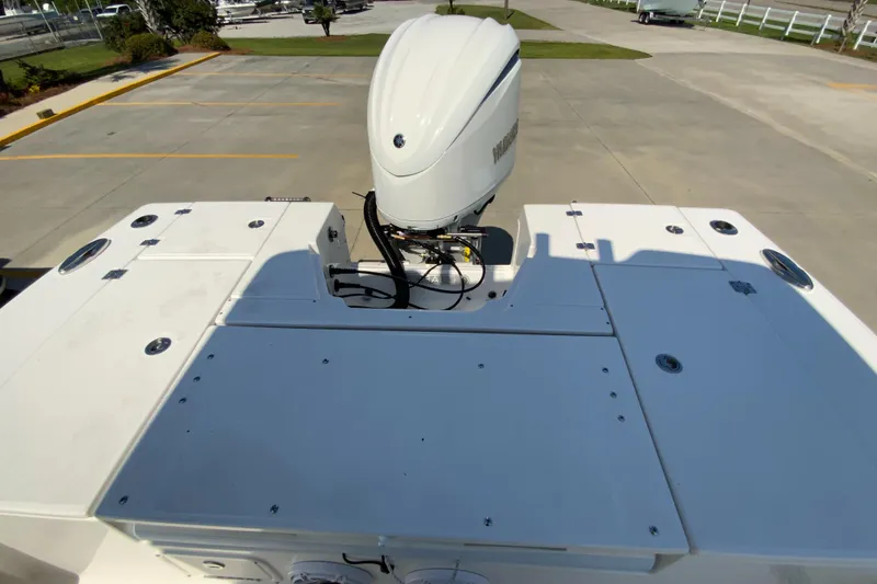 Slide: The Image of 2024 Robalo 246 Cayman boat stern with Yamaha outboard motor. - 7