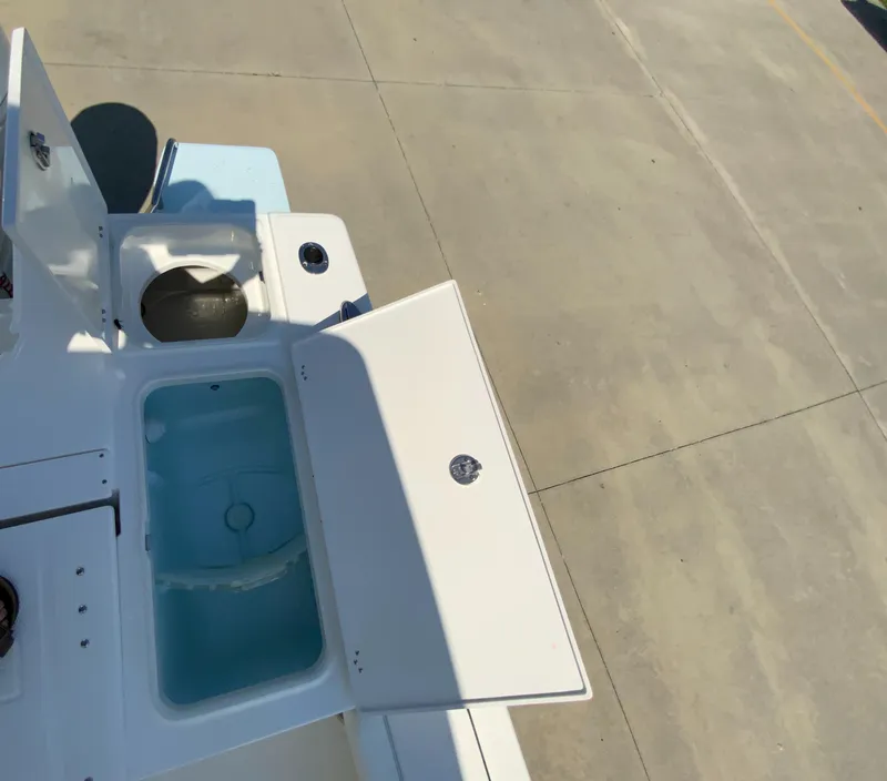 Slide: The Image of 2024 Robalo 246 Cayman boat storage compartments and livewell. - 8