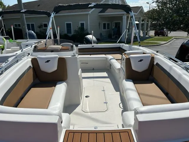 Slide: The Image of 2024 Starcraft SVX 191 boat interior with tan and white seating. - 2