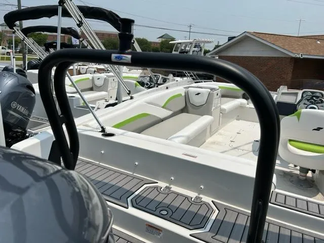 Slide: The Image of 2024 Starcraft SVX 211 Lime Green Sport boat with Yamaha engine, docked. - 11