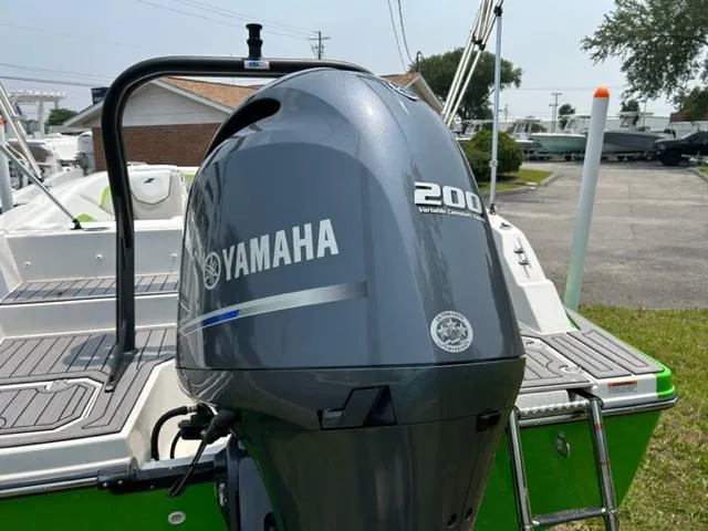 Slide: The Image of 2024 Starcraft SVX 211 Lime Green Sport boat with Yamaha 200 outboard motor. - 5