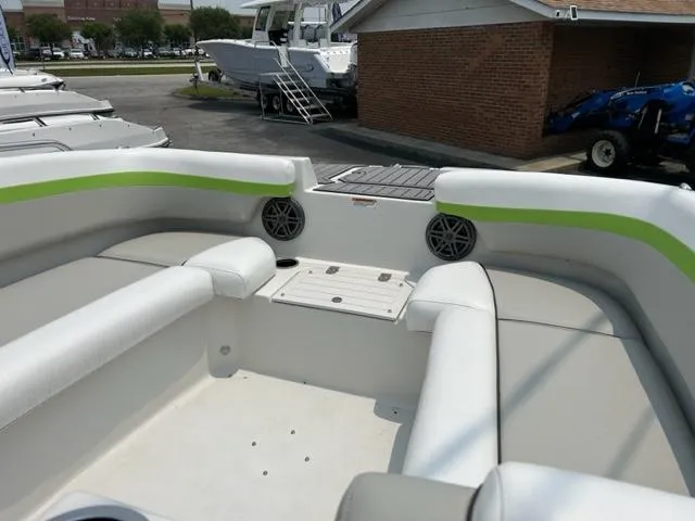 Slide: The Image of 2024 Starcraft SVX 211 Lime Green Sport boat interior with spacious seating. - 8