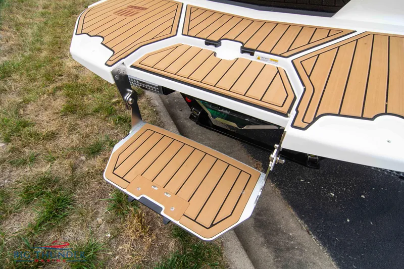 Slide: The Image of 2023 MasterCraft X24 swim platform with teak-style decking. - 10
