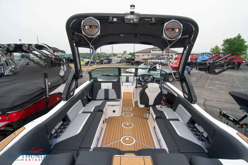 Slide: The Image of 2023 MasterCraft X24 boat interior with seating and sound system. - 14