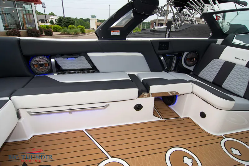 Slide: The Image of 2023 MasterCraft X24 boat interior with luxurious seating and modern design. - 20