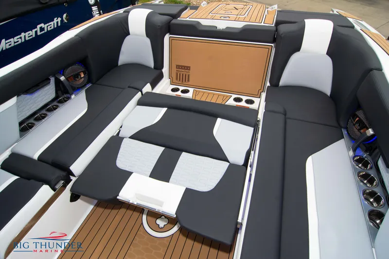 Slide: The Image of 2023 MasterCraft X24 boat interior with luxurious seating and modern design. - 25