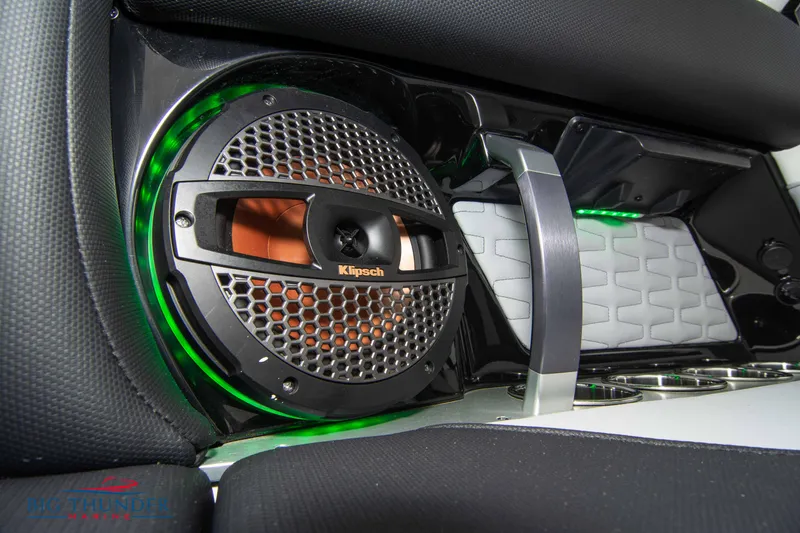 Slide: The Image of 2023 MasterCraft X24 boat interior with Klipsch speaker and green LED lighting. - 34