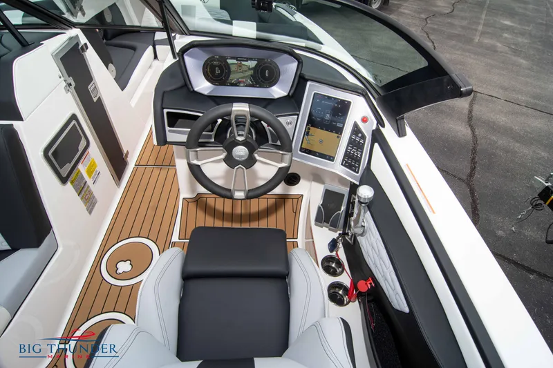 Slide: The Image of 2023 MasterCraft X24 boat cockpit with advanced controls and touchscreen display. - 36