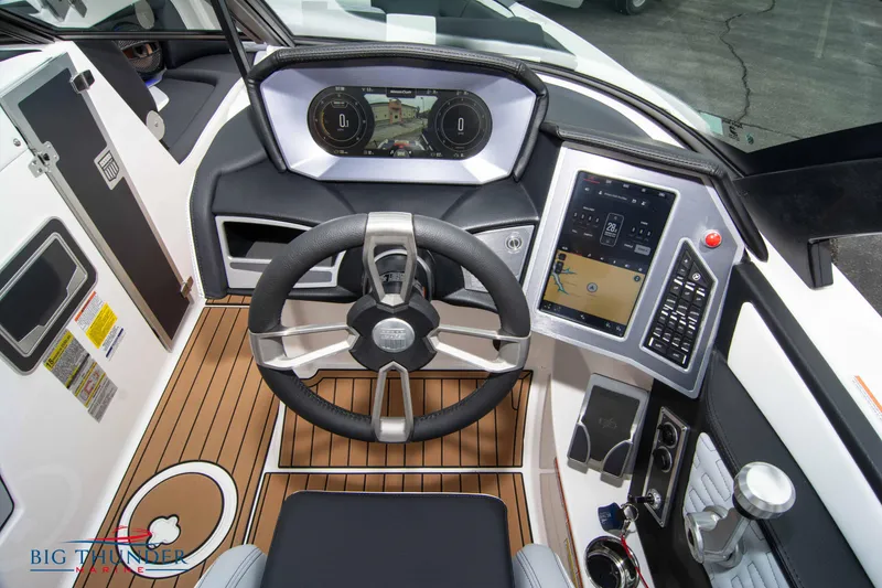 Slide: The Image of 2023 MasterCraft X24 boat cockpit with advanced controls and touchscreen display. - 37