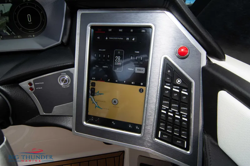 Slide: The Image of 2023 MasterCraft X24 boat dashboard with touchscreen controls and navigation system. - 40